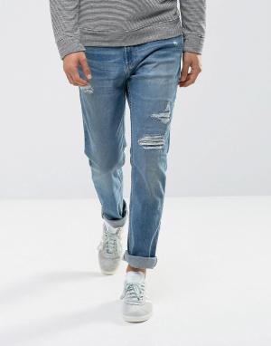 Зауженные джинсы с рваной отделкой Hollister. Цвет: синий
