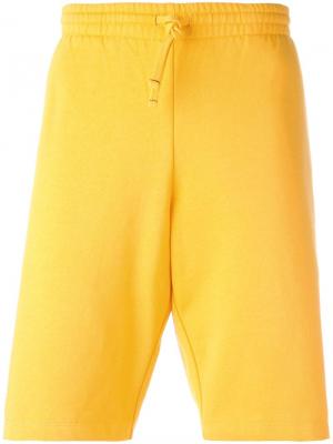 Спортивные шорты Squash Futur. Цвет: жёлтый и оранжевый