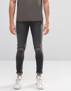 Супероблегающие джинсы с рваными коленями Criminal Damage. Цвет: серый