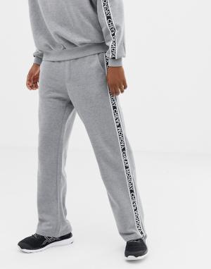 Серые спортивные штаны с фирменной лентой из комплекта Cheap Monday. Цвет: серый