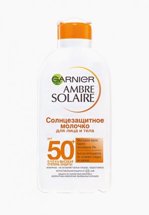 Молочко солнцезащитное Garnier для лица и тела Ambre Solaire, SPF 50+, водостойкое, нежирное, с карите, 200 мл. Цвет: белый