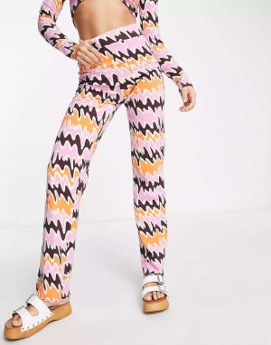 Комфортные прямые брюки с оранжево-розовым абстрактным принтом Monki