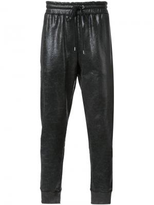 Спортивные брюки с вощеным покрытием Maison Mihara Yasuhiro. Цвет: чёрный