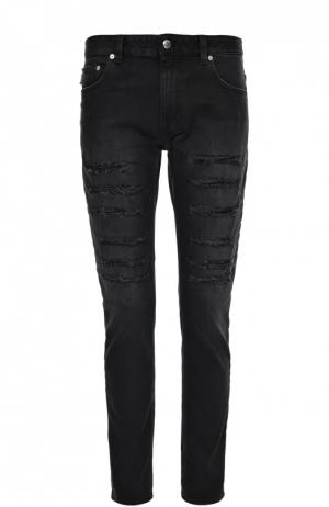 Зауженные джинсы с потертостями Moschino. Цвет: черный