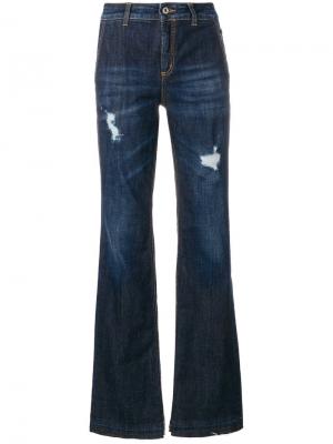 Расклешенные выбеленные джинсы с декоративными дырами Dondup. Цвет: синий